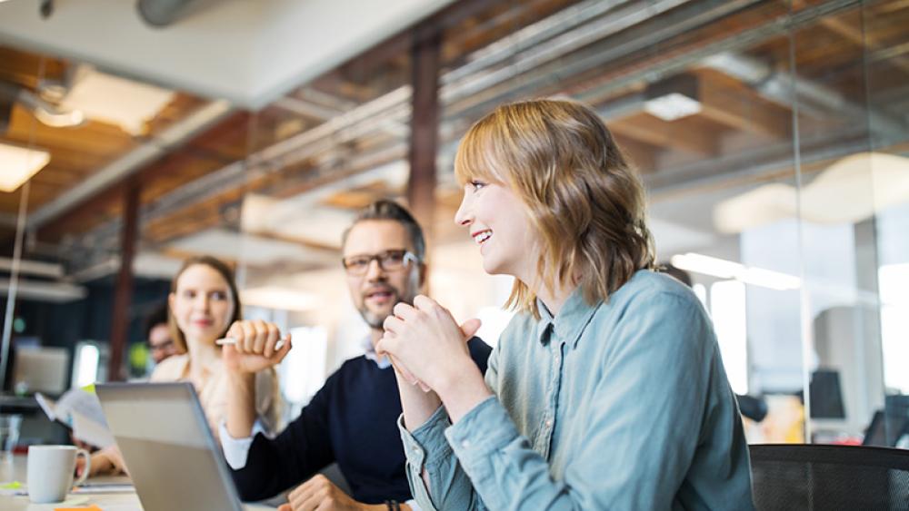 Photo of professionals talking at a table